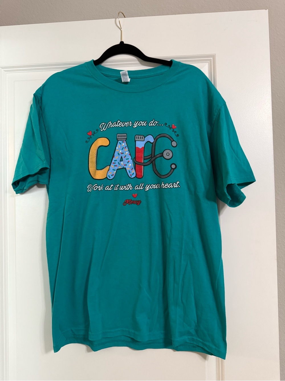 Mercy Nurse Teal Graphic Tee